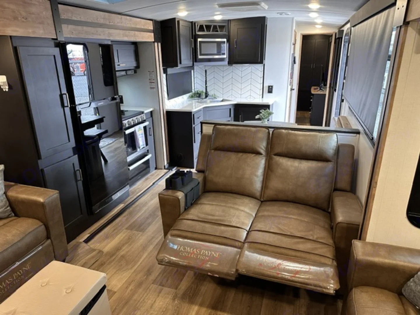 Camper interior looking from the living area toward the kitchen