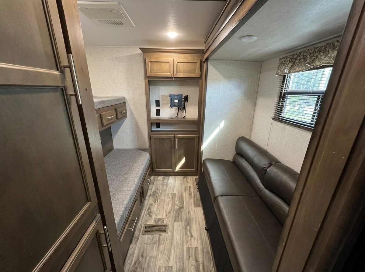 Bunk room with built-in bunks and a sofa that converts to a queen bed