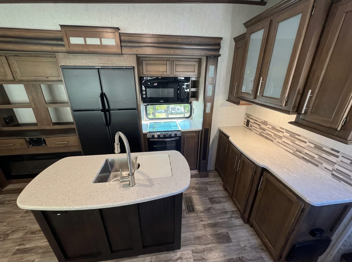 Full kitchen with gas stove, oven, microwave, and refrigerator