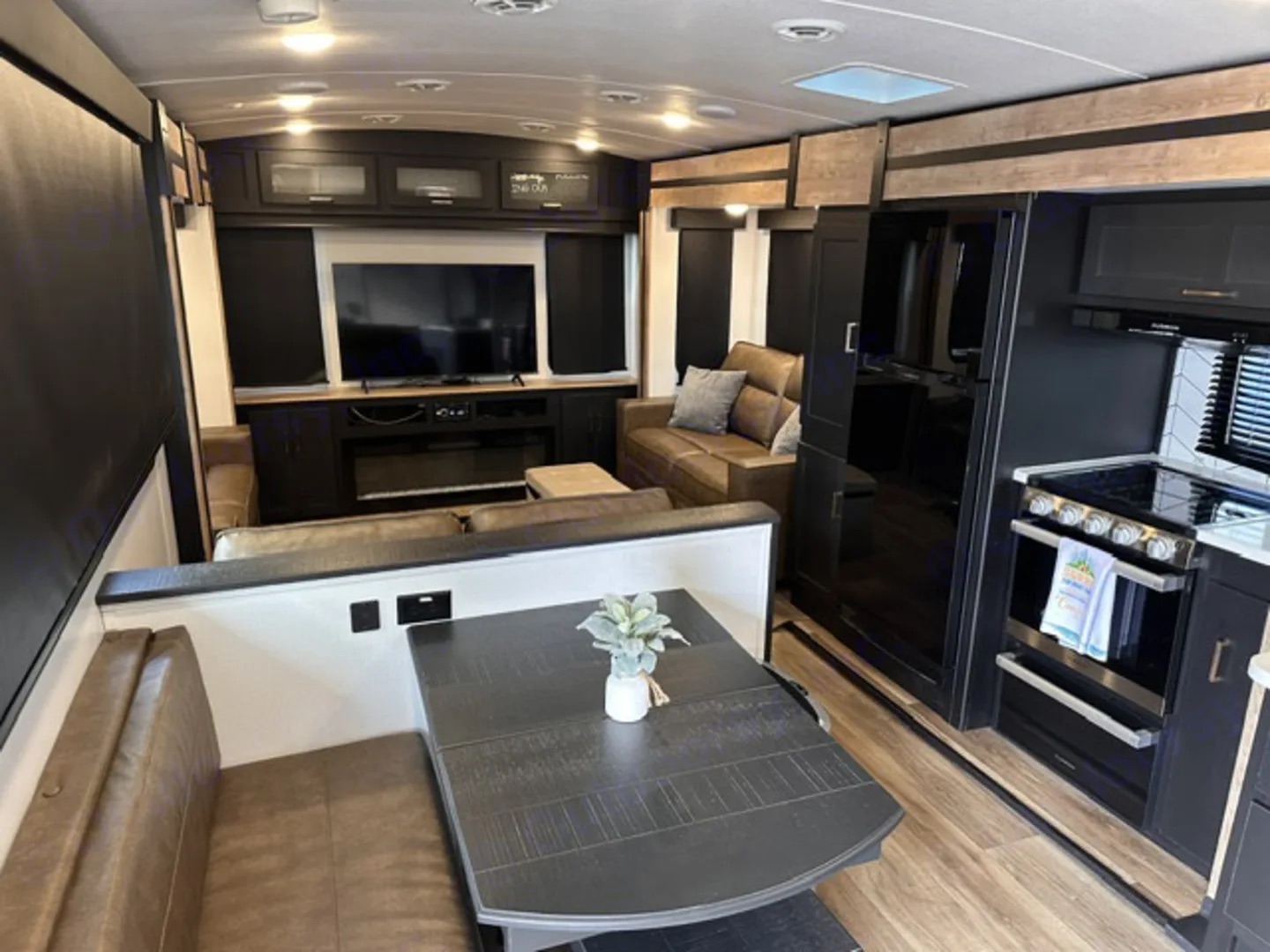 Camper dinette with bench seating open to the living area