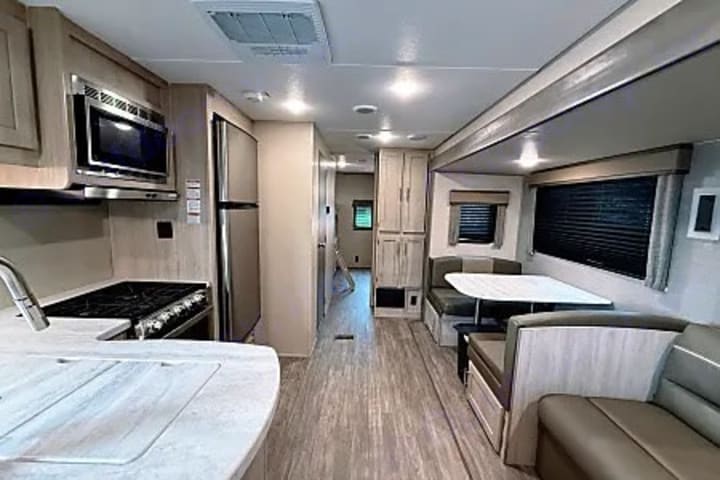 Interior view down the length of the camper from the kitchen