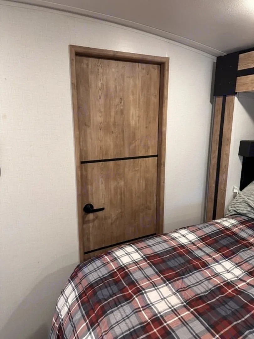 Door closing off the camper bedroom from the rest of the unit