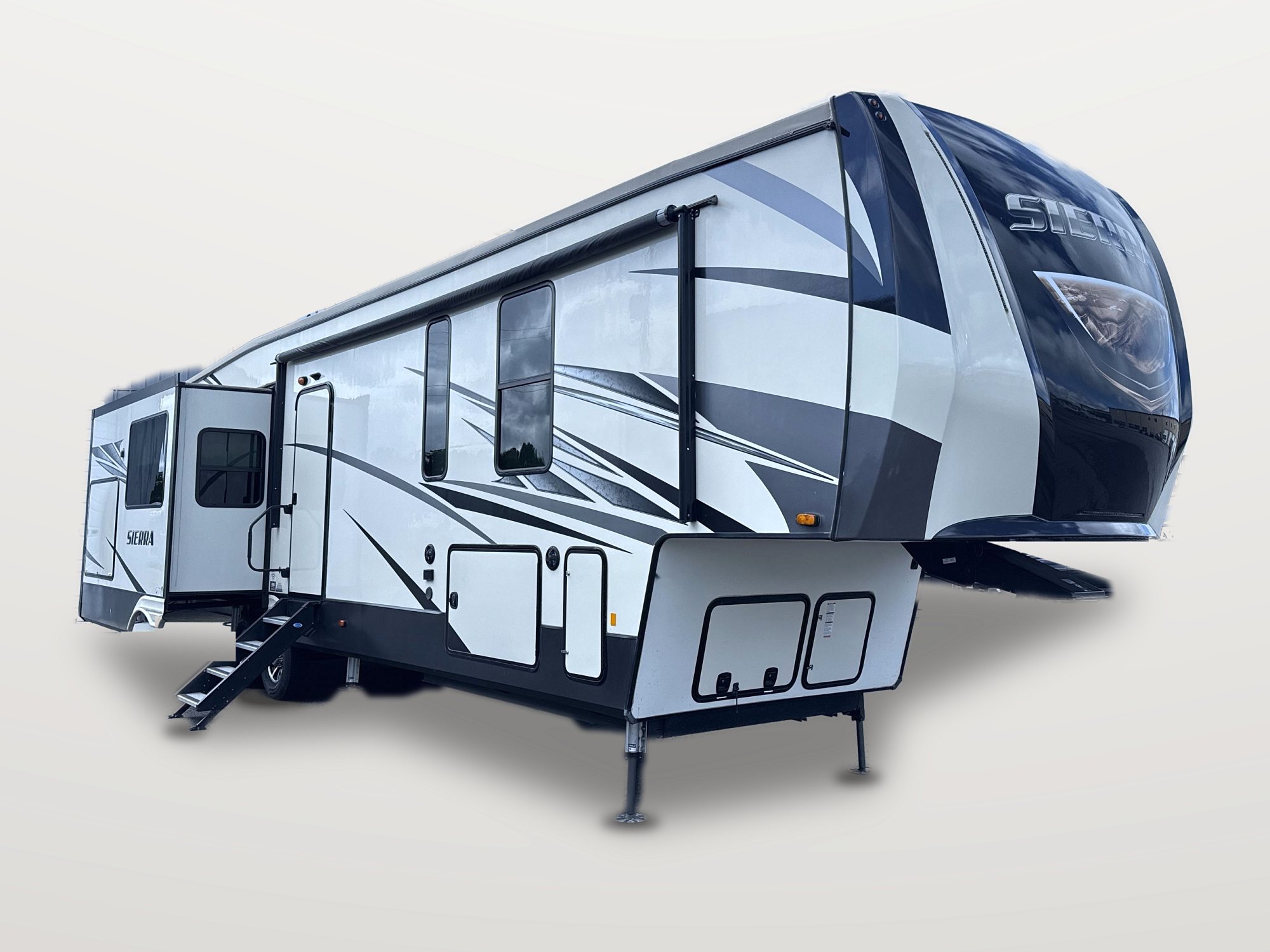 Exterior of a Forest River Sierra fifth wheel with the slide outs extended